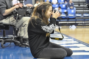 Sarah Anne Harris takes photos at the Quinnipiac basketball game.